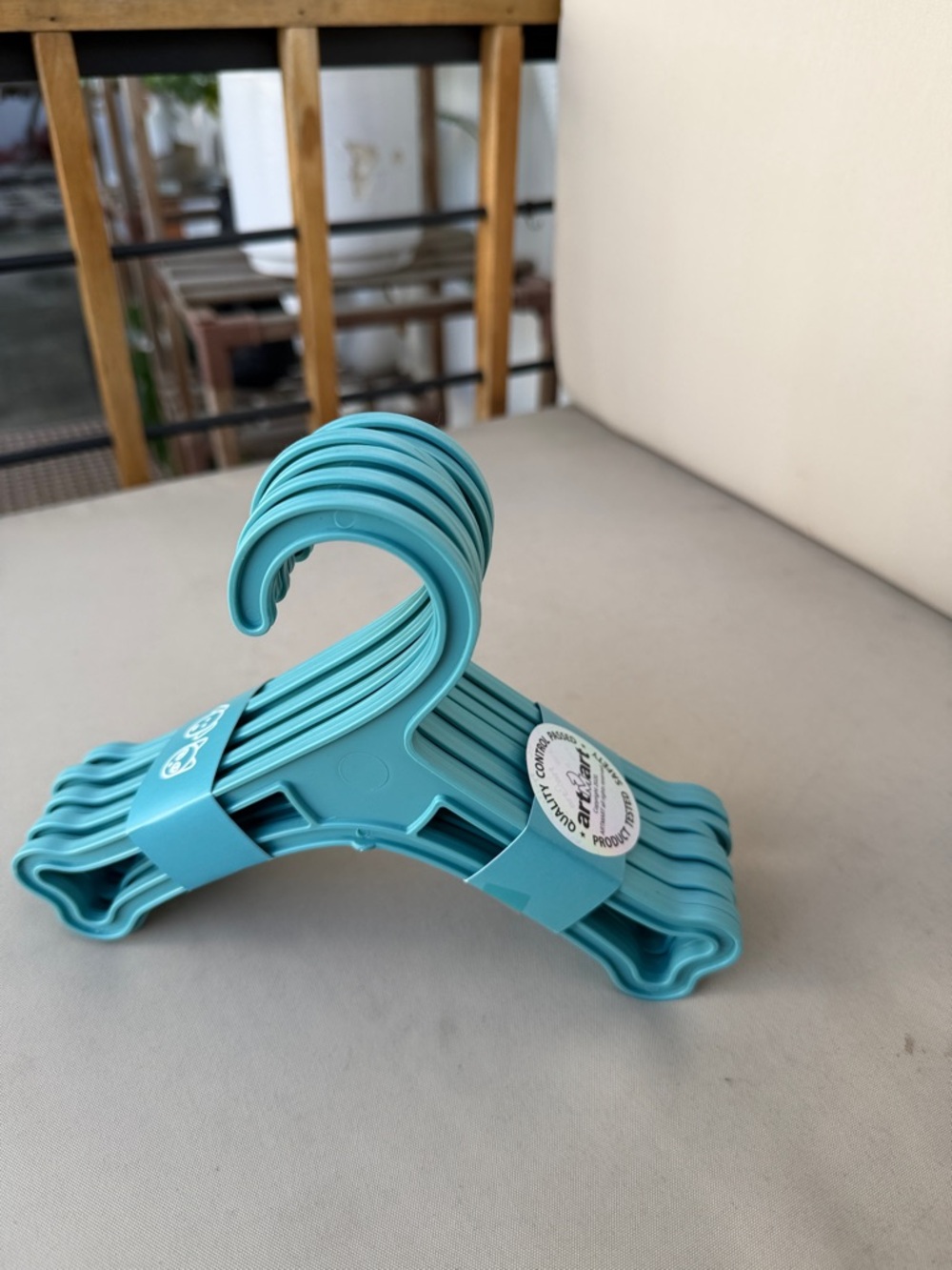 Set of Teal Plastic Clothing Hangers